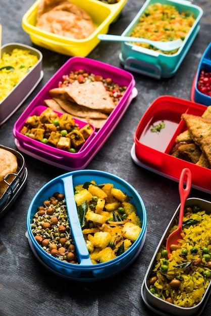 A collage of affordable meal prep containers filled with colorful and nutritious meals, such as rice, beans, vegetables, and chicken, showcasing budget-friendly ingredients and portion control.