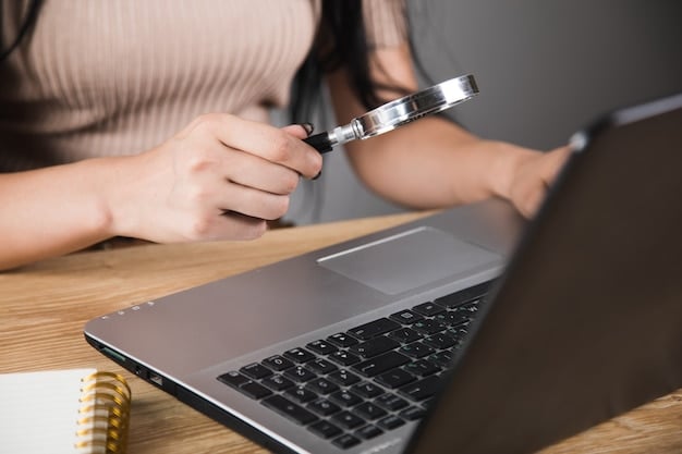 A close-up of a hand pointing to a line item on a bill, with a magnifying glass hovering over it. The background is blurred, but shows the edge of a laptop.
