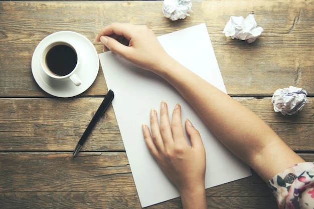 A close-up of a hand writing a letter on a desk, with papers scattered around and a pen in hand, symbolizing the written communication required to exercise rights under the FDCPA.