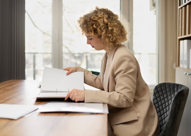A person sitting at a desk, reviewing documents and making notes, projecting an image of diligent financial planning.