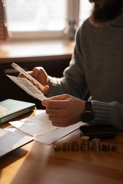 A close-up of a person using a calculator and writing notes, focusing on budgeting and financial planning as part of debt negotiation preparation.