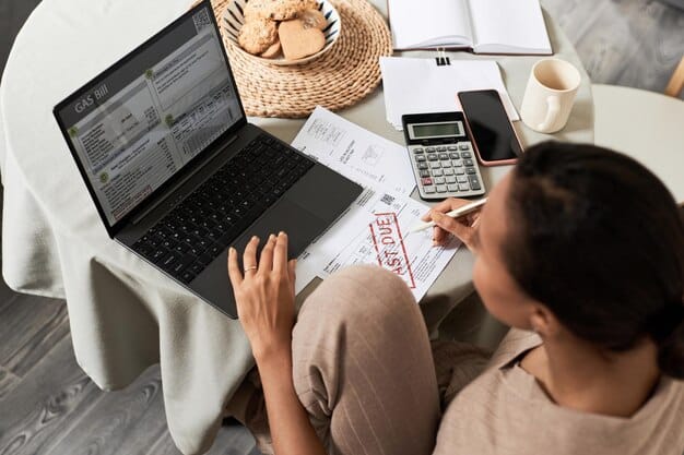 A person using a tax software program on a laptop, with a focus on the screen showing a comparison of itemized vs. standard deductions and the resulting tax savings.